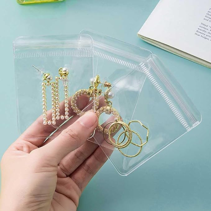 1 Pc Transparent Jewelry Storage Book 84 Pockets Jewelry Album Portable Travel Jewelry Organizer with 60 Pcs Small Clear Plastic Bags for Rings, Necklaces, Bracelets, Studs, Earrings, Brooches
