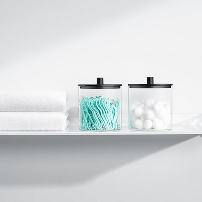 TIPGO Glass Qtip Holder Dispenser - 24 oz Clear Canister Jar, Bathroom Vanity Storage Organizer for Cotton Swabs, Pads, Floss Picks, Small Containers for Makeup Storage (Black)
