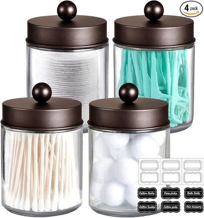 Amolliar 4Pc Apothecary Jars Bathroom Vanity Storage Organizer Set -Countertop Canister with Stainless Steel Lids &Cute Stickers - Qtip Dispenser Holder for Qtips,Cotton Swabs,Makeup Sponges (Bronze)