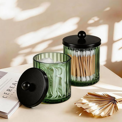Amolliar Sage Green Glass Apothecary Jar, Qtip Holder Dispenser for Cotton Swabs, Balls, Makeup Pads, Floss Picks, Bathroom Essential Accessories, Countertop Canister Storage Organizer (Black, 2 Pack)